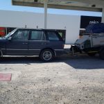 Range Rover P38 with a loaded trailer and coil springs.